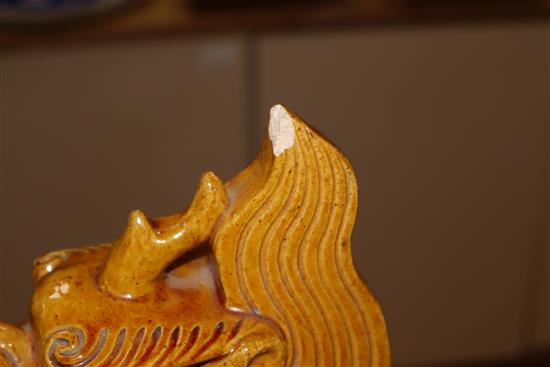 A pair of Chinese earthenware ridge tiles on stands height 46cm